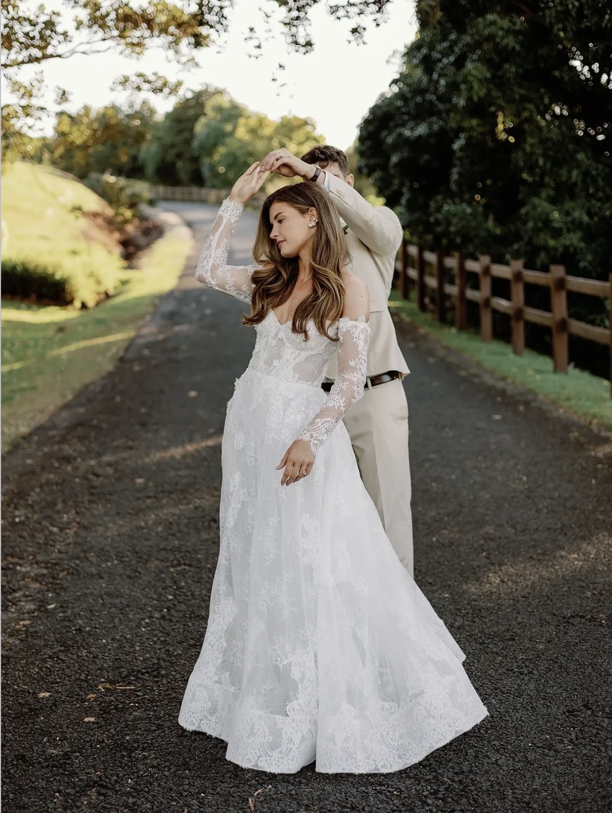 Bride and groom dancing on a garden path — Maree Occasions